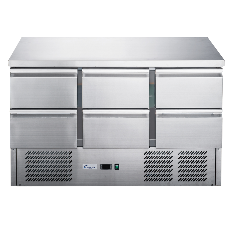 Stainless steel refrigerator with three doors on a white background